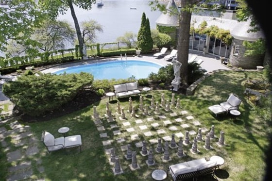 The waterfront side yard at a historic mansion on the harbor in Cohasset, Mass., features a giant chess board, a pool and a stone pool house. For decades it was the New England oceanside playground of the Barrons and the Bancrofts, heirs to the Dow Jones and Wall Street Journal fortunes.